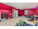 Red bedroom featuring carpeted floor at 589 Vinson Rd, Clayton, NC 27527
