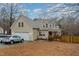 Charming two-story home with attached two car garage, front porch and mature trees at 589 Vinson Rd, Clayton, NC 27527