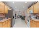 Bright kitchen with stainless steel appliances, wood cabinets and ample counter space at 589 Vinson Rd, Clayton, NC 27527