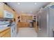 Bright kitchen with stainless steel appliances, wood cabinets and ample counter space at 589 Vinson Rd, Clayton, NC 27527