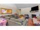 Living room featuring a fireplace, large windows and plush couches at 589 Vinson Rd, Clayton, NC 27527