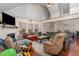 Open floor plan with a fireplace, large windows and hardwood floors at 589 Vinson Rd, Clayton, NC 27527