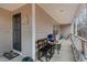 Covered porch with seating, door and decor at 589 Vinson Rd, Clayton, NC 27527