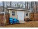 Backyard storage shed with double doors and ample storage space at 589 Vinson Rd, Clayton, NC 27527