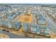 Aerial view of a well-planned community with townhomes, green spaces, and easy street access at 5908 Giddings St, Raleigh, NC 27616
