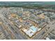An aerial photograph of a community featuring pools, townhomes, parking, and recreational amenities at 5908 Giddings St, Raleigh, NC 27616