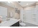 Bright bathroom featuring a shower and tub combination, modern sink, and musical themed decor at 5908 Giddings St, Raleigh, NC 27616