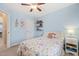 Comfortable bedroom with carpet, shelves, and a ceiling fan at 5908 Giddings St, Raleigh, NC 27616