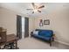 Bedroom with a futon, desk, carpet, and a ceiling fan at 5908 Giddings St, Raleigh, NC 27616