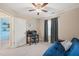 Bedroom with a futon, desk, carpet, and a ceiling fan at 5908 Giddings St, Raleigh, NC 27616