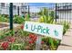 Community garden featuring labeled plots with U-Pick flowers and vibrant greenery at 5908 Giddings St, Raleigh, NC 27616