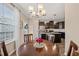 Inviting dining room with a chandelier and a view of the kitchen and backyard through the sliding glass door at 5908 Giddings St, Raleigh, NC 27616