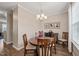 Lovely dining room with a chandelier, wood table, and seating for four at 5908 Giddings St, Raleigh, NC 27616
