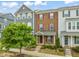 Charming brick townhome with a manicured front lawn and inviting entrance at 5908 Giddings St, Raleigh, NC 27616