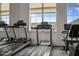 Modern fitness center equipped with treadmills overlooking the neighborhood enhances wellness opportunities at 5908 Giddings St, Raleigh, NC 27616