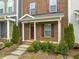 Inviting front porch with red brick and colorful landscaping at 5908 Giddings St, Raleigh, NC 27616