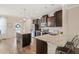 Beautiful kitchen with a spacious island, granite countertops, stainless steel appliances, and dark cabinetry at 5908 Giddings St, Raleigh, NC 27616