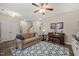 Inviting living room featuring neutral walls, stylish rug, and comfortable furnishings at 5908 Giddings St, Raleigh, NC 27616