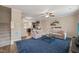 Bright living room with a sectional sofa, open to the kitchen and dining areas, and featuring a blue area rug at 5908 Giddings St, Raleigh, NC 27616