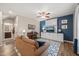 Cozy living room with hardwood floors, blue accent wall and comfortable seating area at 5908 Giddings St, Raleigh, NC 27616