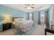 Spacious main bedroom with a tray ceiling, ceiling fan, carpet, and windows at 5908 Giddings St, Raleigh, NC 27616