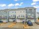 Townhome exterior showing garage, balconies, and well-maintained landscaping in a desirable community at 5908 Giddings St, Raleigh, NC 27616
