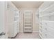 Organized walk-in closet with built-in shelving and ample storage space at 5908 Giddings St, Raleigh, NC 27616
