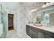 Modern bathroom features double vanity, walk-in closet, and decorative wallpaper at 67 Rice Road # 01, Zebulon, NC 27597