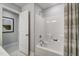 Bright bathroom features a white tub and shower combo and patterned shower curtain at 67 Rice Road # 01, Zebulon, NC 27597