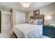 Comfortable bedroom boasts soft lighting, a stylish bedframe, and tasteful decor at 67 Rice Road # 01, Zebulon, NC 27597