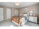 Bedroom featuring a bed with colorful bedding and a bedside table with a lamp at 67 Rice Road # 01, Zebulon, NC 27597