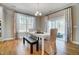 Elegant dining room with hardwood floors, natural light, and contemporary decor at 67 Rice Road # 01, Zebulon, NC 27597
