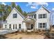 Charming two-story home with attractive gray siding, beautiful landscaping, and a welcoming front entrance at 67 Rice Road # 01, Zebulon, NC 27597
