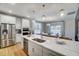 Bright kitchen with a large central island with bar seating, stainless appliances, and an eating nook at 67 Rice Road # 01, Zebulon, NC 27597