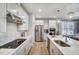 Open concept kitchen with stainless steel appliances, modern fixtures, and an island with seating at 67 Rice Road # 01, Zebulon, NC 27597