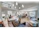 Open concept living room and kitchen with soaring ceilings, great lighting, and stainless appliances at 67 Rice Road # 01, Zebulon, NC 27597