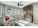 Loft space features a cozy seating area, bookcase, and natural light from large windows at 67 Rice Road # 01, Zebulon, NC 27597