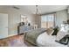 Relaxing main bedroom showcasing wood floors, a plush bed, and natural light at 67 Rice Road # 01, Zebulon, NC 27597