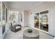 Cozy screened porch with wicker furniture, perfect for enjoying the outdoors at 67 Rice Road # 01, Zebulon, NC 27597