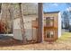 View of the back of the house featuring a wooden deck and walkout basement at 7 Misty Creek Ct, Durham, NC 27705