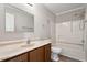 The bathroom has a vanity with a sleek countertop and a well-maintained shower-tub combo, promoting relaxation at 7 Misty Creek Ct, Durham, NC 27705