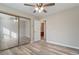 Spacious bedroom with a sliding mirror closet, offering functionality and style, and providing ample storage solutions at 7 Misty Creek Ct, Durham, NC 27705