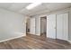 This bedroom features wood-look flooring and two closets for plenty of storage at 7 Misty Creek Ct, Durham, NC 27705