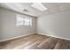 An additional bedroom with wood-look flooring and natural light at 7 Misty Creek Ct, Durham, NC 27705
