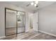 This bedroom boasts wood-look flooring, a mirrored closet, and an attached bathroom for added convenience at 7 Misty Creek Ct, Durham, NC 27705