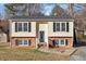 Charming two-story home featuring a brick foundation and classic black shutters at 7 Misty Creek Ct, Durham, NC 27705