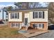 Charming two-story home featuring a brick foundation and classic black shutters at 7 Misty Creek Ct, Durham, NC 27705