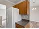 This kitchen features classic cabinetry and a bright, clean refrigerator providing ample space for storage and food preservation at 7 Misty Creek Ct, Durham, NC 27705