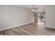 Living room featuring stylish floors, a ceiling fan, and a sliding door at 7 Misty Creek Ct, Durham, NC 27705
