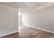 An additional empty room with wood-look flooring and neutral colored walls at 7 Misty Creek Ct, Durham, NC 27705